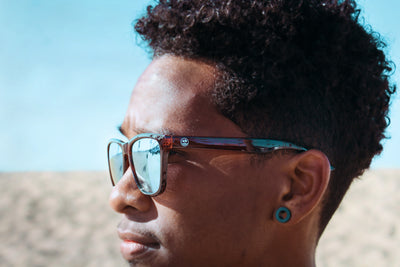 Person wearing sunglasses at the beach
